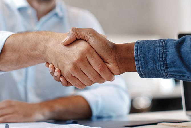 Two people shaking hands