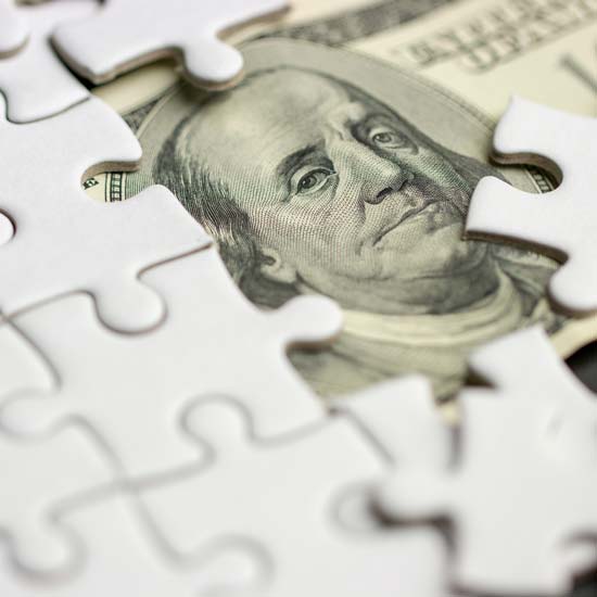 Puzzle with money hiding underneath