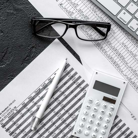 Glasses, Calculator, Pen and Paper